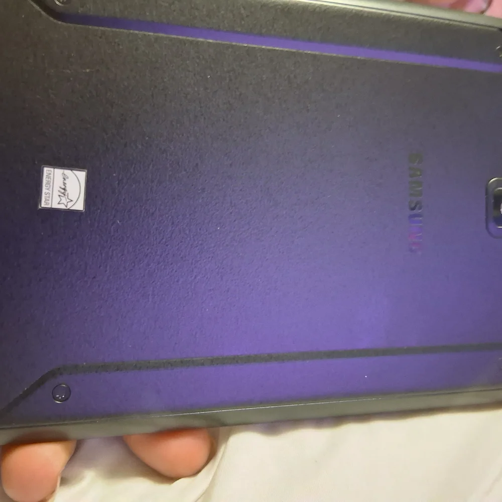 Samsung Tablet with Black Bezel and Blue Display